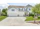 Charming two-story home with a well-manicured lawn, two-car garage, and a welcoming front entrance at 11121 Godfrey Dr, Noblesville, IN 46060