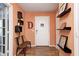 Inviting foyer with decorative shelving, modern accents, and wooden floors to welcome visitors at 11121 Godfrey Dr, Noblesville, IN 46060