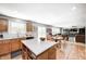 Open-concept kitchen boasts an island with quartz countertops and flows into the living and dining areas at 11121 Godfrey Dr, Noblesville, IN 46060