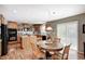 Eat-in kitchen features wooden cabinets, stainless steel appliances, and a table for casual dining at 11121 Godfrey Dr, Noblesville, IN 46060
