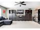 Inviting living room with plush furniture, lots of shelving, and a ceiling fan at 11121 Godfrey Dr, Noblesville, IN 46060