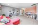 Bright living room with a comfortable sofa, custom shelving and large windows at 11121 Godfrey Dr, Noblesville, IN 46060