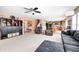 Comfortable living room with an open layout, visible staircase, and views into the kitchen at 11121 Godfrey Dr, Noblesville, IN 46060