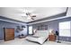 Comfortable bedroom boasts tray ceilings, soft carpet, and natural light from large windows at 11121 Godfrey Dr, Noblesville, IN 46060