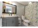 Well-lit bathroom with updated vanity, modern fixtures, and patterned shower curtain at 1215 N Pershing Ave, Indianapolis, IN 46222
