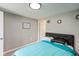 Bedroom featuring neutral walls and decor, light fixture, and plush carpet at 1215 N Pershing Ave, Indianapolis, IN 46222