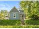 Charming cottage-style home with a lovely yard and inviting entrance at 1215 N Pershing Ave, Indianapolis, IN 46222