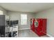 Laundry room features red front load washer and dryer, and utility sink at 1215 N Pershing Ave, Indianapolis, IN 46222