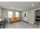 Cozy living room with neutral colors and view into the bedroom at 1215 N Pershing Ave, Indianapolis, IN 46222