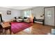 Bright living room featuring hardwood floors, natural light, and a comfortable sectional sofa at 1225 N Graham Ave, Indianapolis, IN 46219