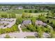 Aerial view of luxury homes and a golf course in a wooded neighborhood at 12399 Lynnwood Blvd, Carmel, IN 46033