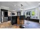 Finished basement kitchen with stainless steel appliances and hardwood flooring at 12399 Lynnwood Blvd, Carmel, IN 46033