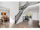 Grand foyer with staircase and view into dining room and sitting area at 12399 Lynnwood Blvd, Carmel, IN 46033