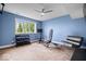 Home gym with workout equipment, bright blue walls, and natural light at 12399 Lynnwood Blvd, Carmel, IN 46033