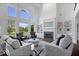 Bright living room with soaring ceilings, fireplace and large windows at 12399 Lynnwood Blvd, Carmel, IN 46033