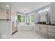 Spa-like bathroom with a soaking tub, a glass enclosed shower, and dual vanities at 12399 Lynnwood Blvd, Carmel, IN 46033