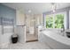 Bright bathroom with soaking tub, shower, and vanity at 12399 Lynnwood Blvd, Carmel, IN 46033