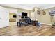 Finished basement area with wood-look flooring featuring an office space and an open doorway at 125 W Chalet Dr, Mooresville, IN 46158