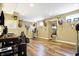 Finished basement featuring wood floors, multiple deer head mounts, and a window providing natural light at 125 W Chalet Dr, Mooresville, IN 46158
