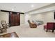 Spacious finished basement features recessed lighting, barn doors, and comfortable seating at 125 W Chalet Dr, Mooresville, IN 46158