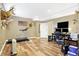 Finished basement with a treadmill, desk, and unique decor at 125 W Chalet Dr, Mooresville, IN 46158