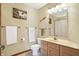 Bright bathroom with a single vanity, neutral walls, tile floors, and coordinated decor at 125 W Chalet Dr, Mooresville, IN 46158