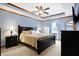 Well-lit bedroom with a king-sized bed, bedside tables, and soft neutral colored decor at 125 W Chalet Dr, Mooresville, IN 46158