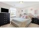 Charming bedroom features a cozy bed, dark furniture, and a window with a view at 125 W Chalet Dr, Mooresville, IN 46158