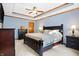 Large bedroom with a dark wood bed frame, bedside tables, and a coffered ceiling at 125 W Chalet Dr, Mooresville, IN 46158