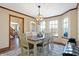 Formal dining room with chandelier, lots of natural light and wood trim at 125 W Chalet Dr, Mooresville, IN 46158