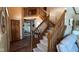 Inviting foyer with a wooden staircase, hardwood floors, and an open layout at 125 W Chalet Dr, Mooresville, IN 46158