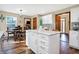 Open-concept kitchen and dining area featuring an island and a view into the living room at 125 W Chalet Dr, Mooresville, IN 46158