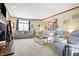 Spacious living room with comfortable seating, fireplace, staircase, and lots of natural light at 125 W Chalet Dr, Mooresville, IN 46158