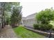 Professionally landscaped backyard with new sod, privacy fence, and mature trees provides a serene outdoor escape at 1297 Morningside Dr, Greenfield, IN 46140
