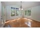 Bright breakfast nook with hardwood floors, decorative windows and door to the outside at 1297 Morningside Dr, Greenfield, IN 46140