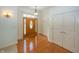Welcoming foyer with gleaming hardwood floors and a wooden door with decorative glass at 1297 Morningside Dr, Greenfield, IN 46140