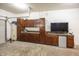 Finished garage featuring ample cabinet and counter space with wet bar and refrigerator at 1297 Morningside Dr, Greenfield, IN 46140
