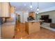 Bright and spacious kitchen with light wood cabinetry, hardwood floors, and stainless steel appliances at 1297 Morningside Dr, Greenfield, IN 46140