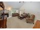 Spacious living room featuring neutral carpet, a fireplace, vaulted ceiling, and plush sofas at 1297 Morningside Dr, Greenfield, IN 46140