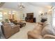 Bright and airy living room featuring a vaulted ceiling, neutral carpet, and a view to the entry at 1297 Morningside Dr, Greenfield, IN 46140