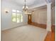 Bright living room featuring hardwood flooring, large windows, and an arched entrance at 1297 Morningside Dr, Greenfield, IN 46140