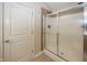 Shower featuring glass doors, tile surround and flooring at 1297 Morningside Dr, Greenfield, IN 46140