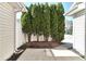 Private backyard area with patio and mature trees at 13499 Molique Blvd, Fishers, IN 46037