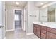 Bright bathroom featuring a double sink vanity with a large mirror and a separate shower at 13499 Molique Blvd, Fishers, IN 46037