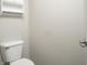 Powder room featuring a toilet and a pedestal sink at 13499 Molique Blvd, Fishers, IN 46037