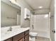 Bathroom featuring a shower and bath, vanity with wood cabinets, and a matching medicine cabinet at 13499 Molique Blvd, Fishers, IN 46037
