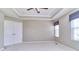 Neutral primary bedroom features a closet, window coverings, and plush carpeting at 13499 Molique Blvd, Fishers, IN 46037