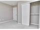 Neutral bedroom features a closet and plush carpeting for a comfortable living space at 13499 Molique Blvd, Fishers, IN 46037