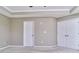 Neutral primary bedroom features a closet, doorway to other room, and plush carpeting at 13499 Molique Blvd, Fishers, IN 46037