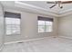 Neutral primary bedroom features a tray ceiling, window coverings, and plush carpeting at 13499 Molique Blvd, Fishers, IN 46037